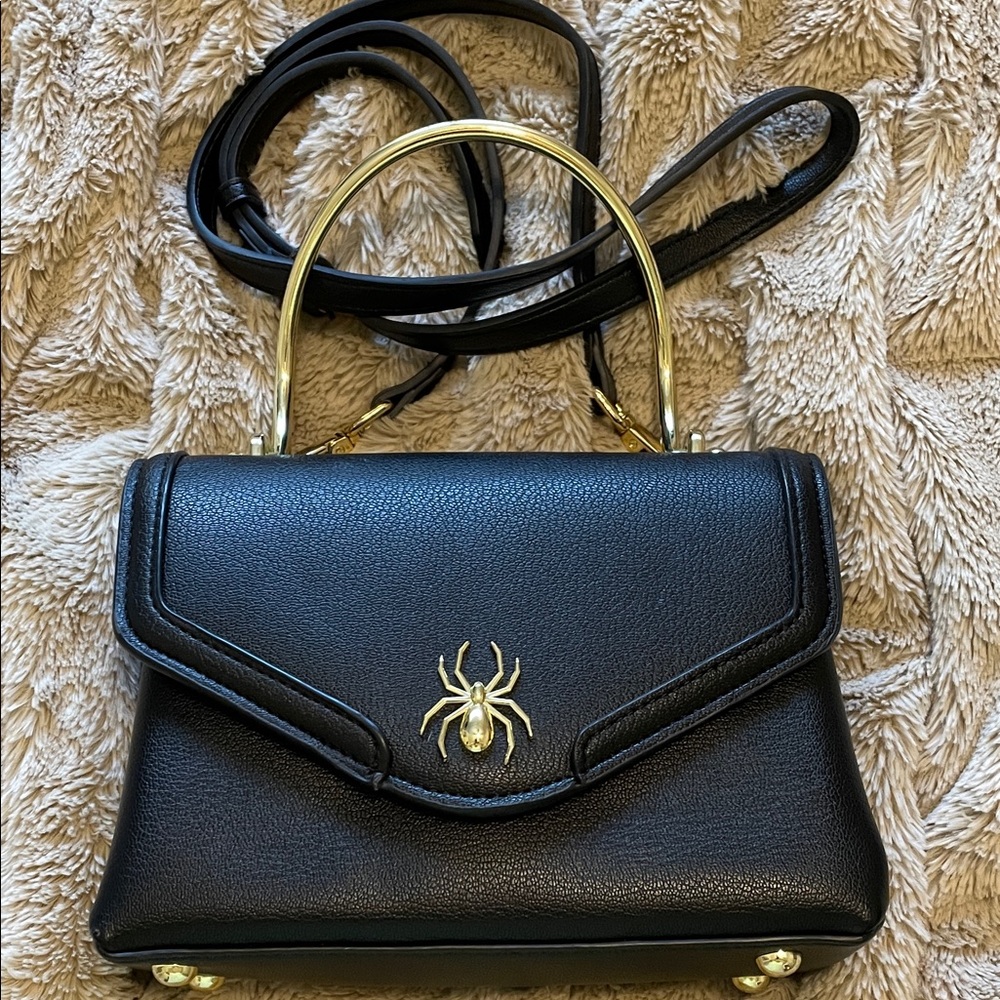 Elegant Black Handbag with Gold Accents
